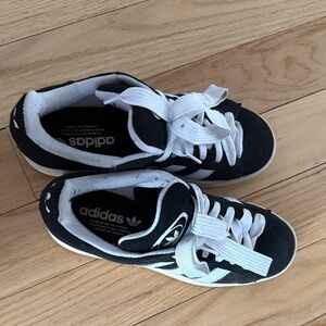 Adidas woman’s Black and White campus Sneakers.